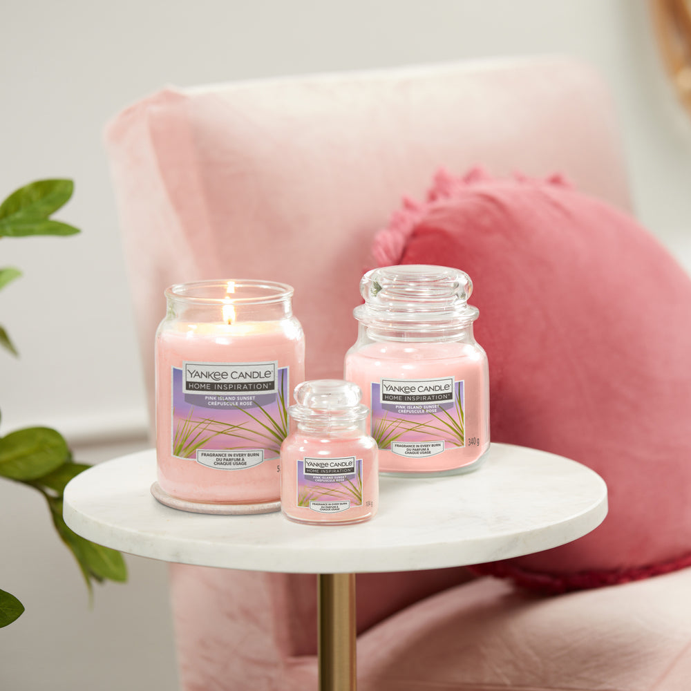 Pink Island Sunset Large Jar Tropical fruits and citrus of the Yankee Candle® Home Inspiration™ Candle will have you thinking of gentle trade winds and full, pink sunsets stretching the horizon.
