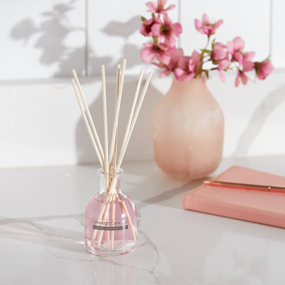 Sugared Blossom Reed Diffuser Colourful blossoms, sparkling with sugar crystals, placed upon a delicious frosted confection. 