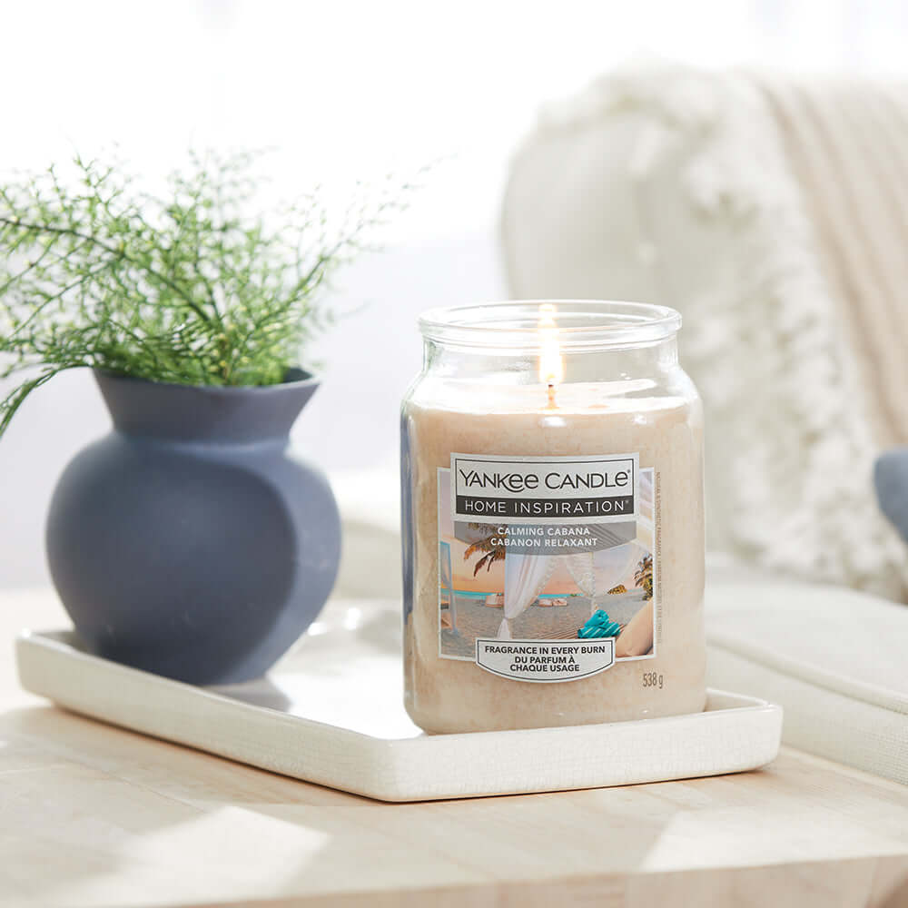 Calming Cabana Medium Jar A light breeze gently passes through your seaside cabana, carrying scents of lemony verbena, oakmoss, and warm amber. 