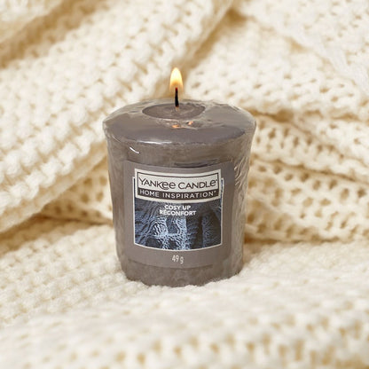 Cosy Up Votive Add a warm and cosy vibe to your home with the Yankee Candle® Home Inspiration™ Cozy Up Candle. A touch of amber, a dash of petals and lots of all things soft and comforting. 
