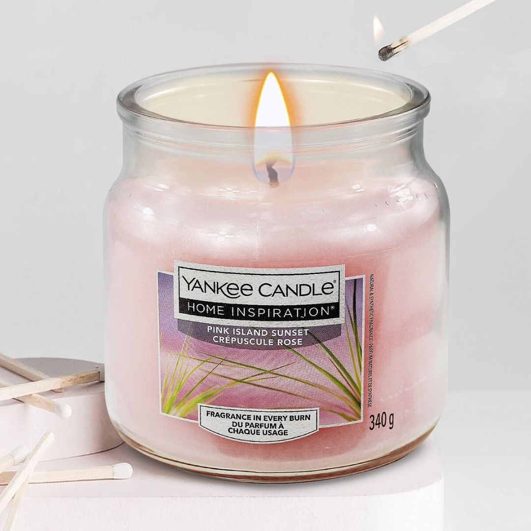 Pink Island Sunset Medium Jar Tropical fruits and citrus of the Yankee Candle® Home Inspiration™ Candle will have you thinking of gentle trade winds and full, pink sunsets stretching the horizon. 