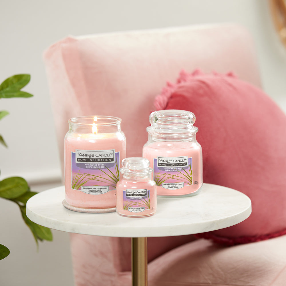 Pink Island Sunset Large Jar Tropical fruits and citrus of the Yankee Candle® Home Inspiration™ Candle will have you thinking of gentle trade winds and full, pink sunsets stretching the horizon. 